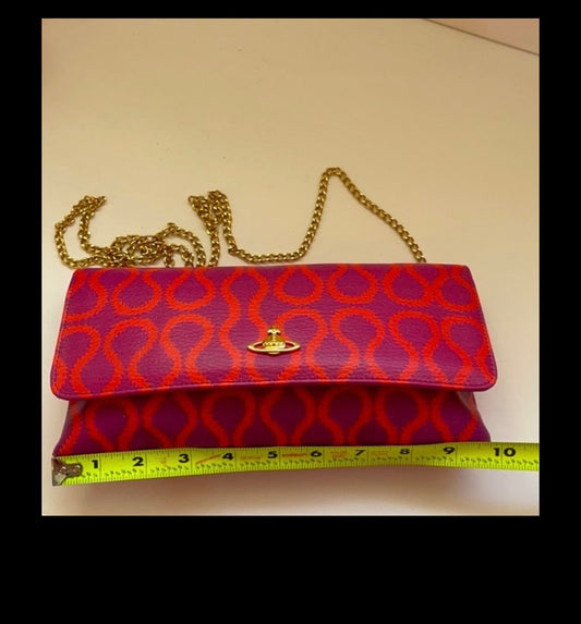 Vivienne Westwood Vintage squiggle clutch/ Cuff/ Anglomania t-shirt/ Red Label dress